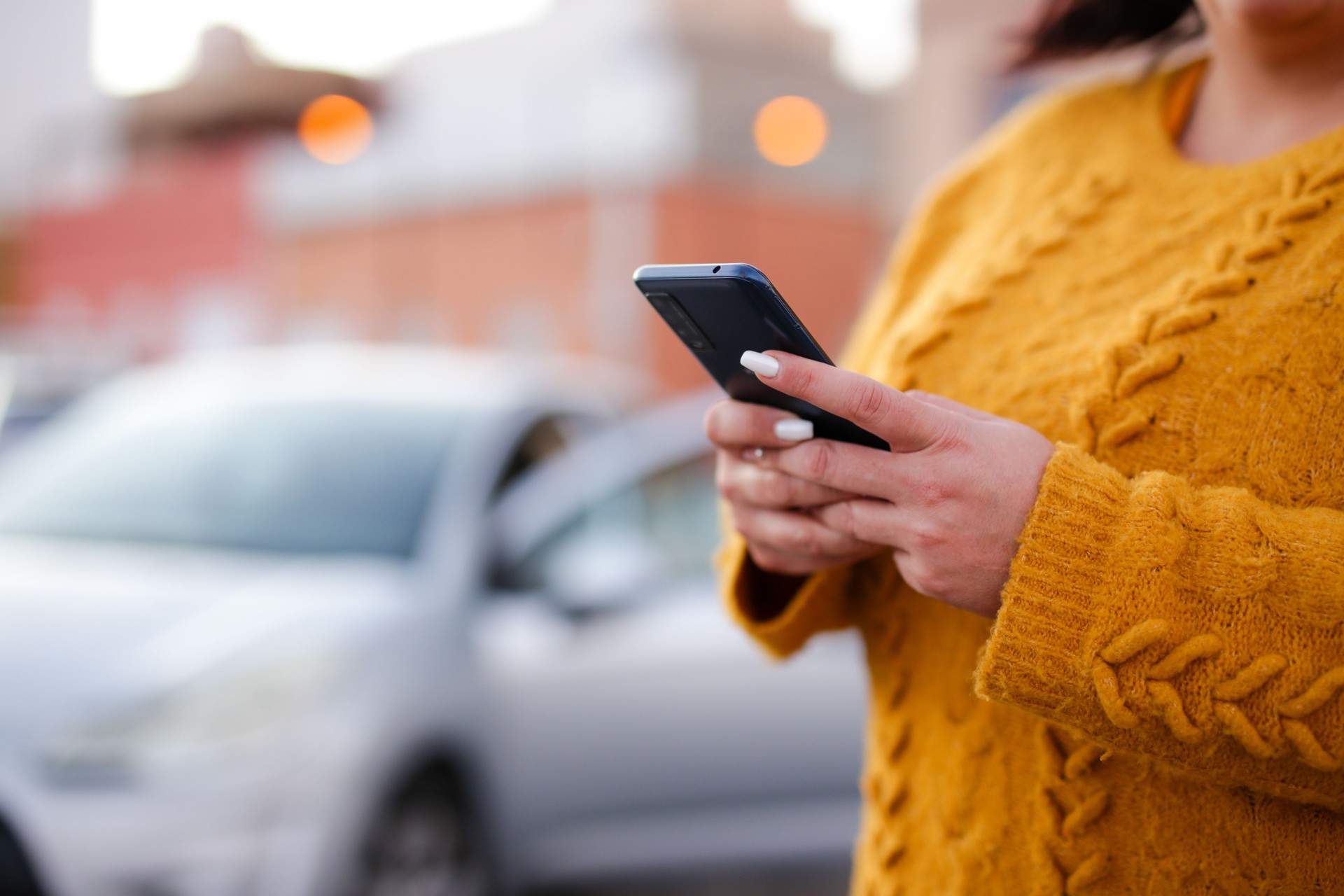 young woman Hispanic crashed with his car using his cell phone. road safety concept