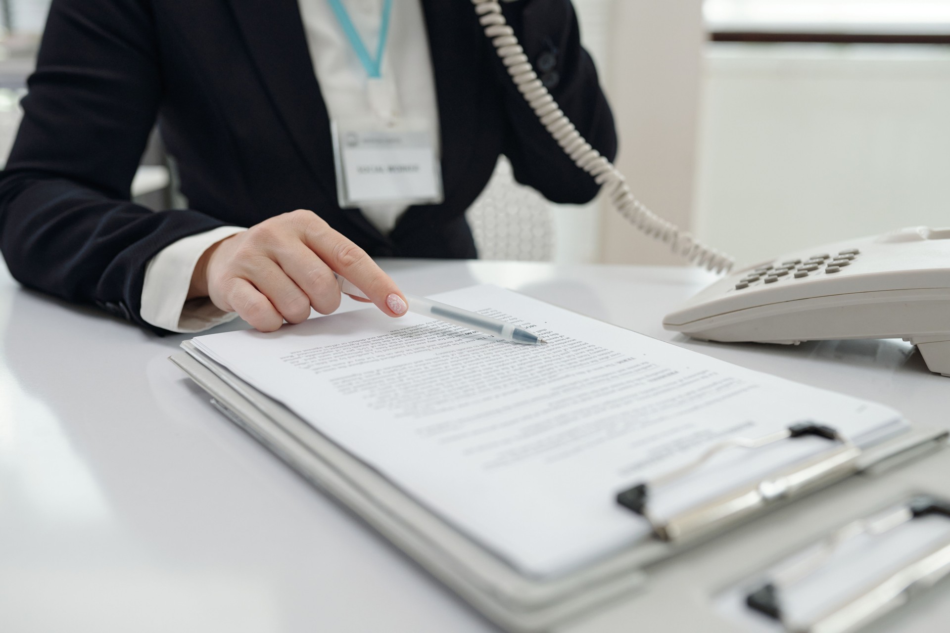 Social Worker Discussing Document By The Phone